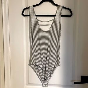 Striped bodysuit with low back. Size S. Brand Susymix